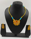 Terracotta kanthi set embellished with blue glass beads.