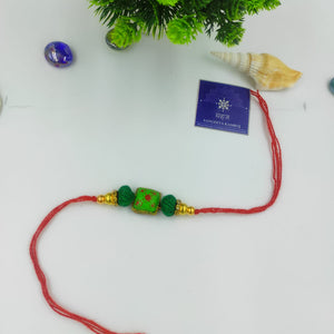 HANDMADE TERRACOTTA PARROT GREEN BHAI RAKHI WITH COTTON BEADS