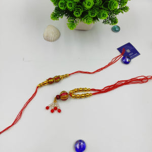 HANDMADE TERRACOTTA RED GOLDEN BALL COUPLE RAKHI