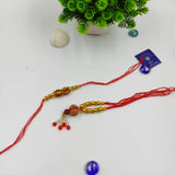HANDMADE TERRACOTTA RED GOLDEN BALL COUPLE RAKHI